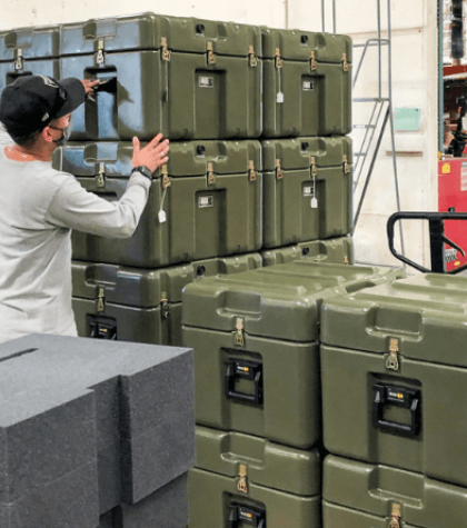 Molded case in army green color with handles for safe and secure transport.