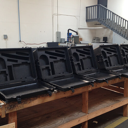 Pelican cases with custom foam cushioning system