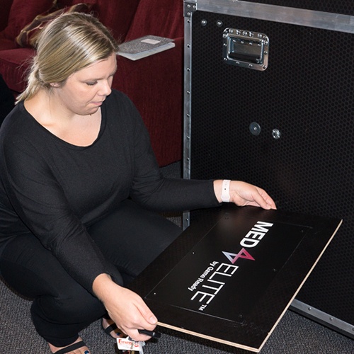 LPC team member adding the customer's branding to their new ATA case. 