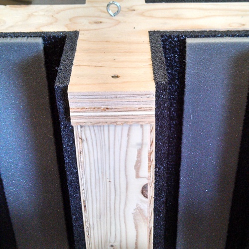 Close up of wooden crate with foam cushioning inserts to protect the product inside