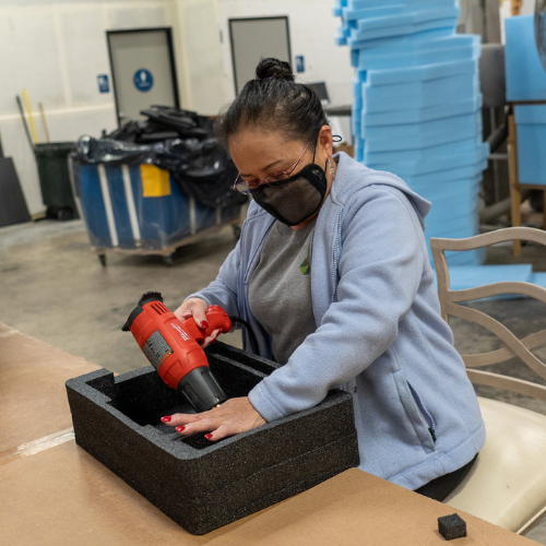 LPC team member adding the final touches to a custom designed and made foam insert