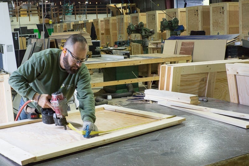 LPC team member manufacturing a custom-built server rack