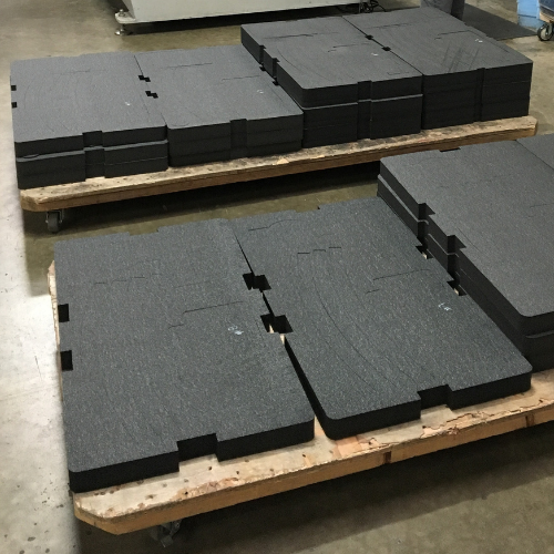 Stacks of foam ready to be used to cushion and protect equipment in crates