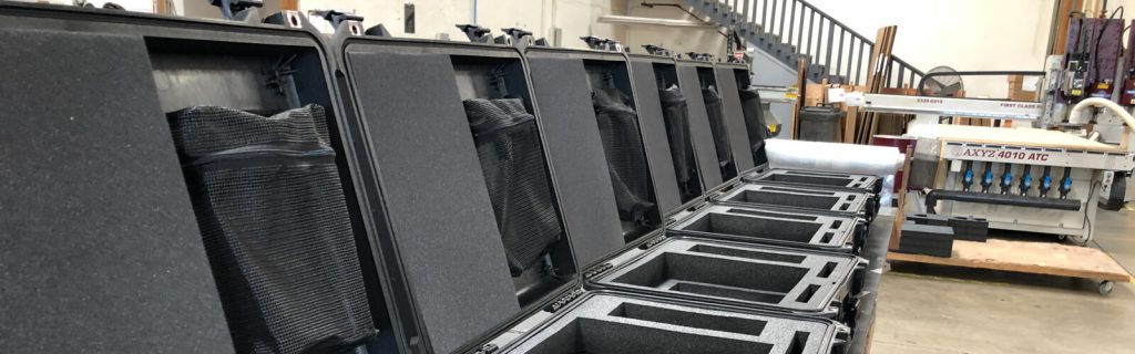 Row of Pelican cases with custom foam inserts